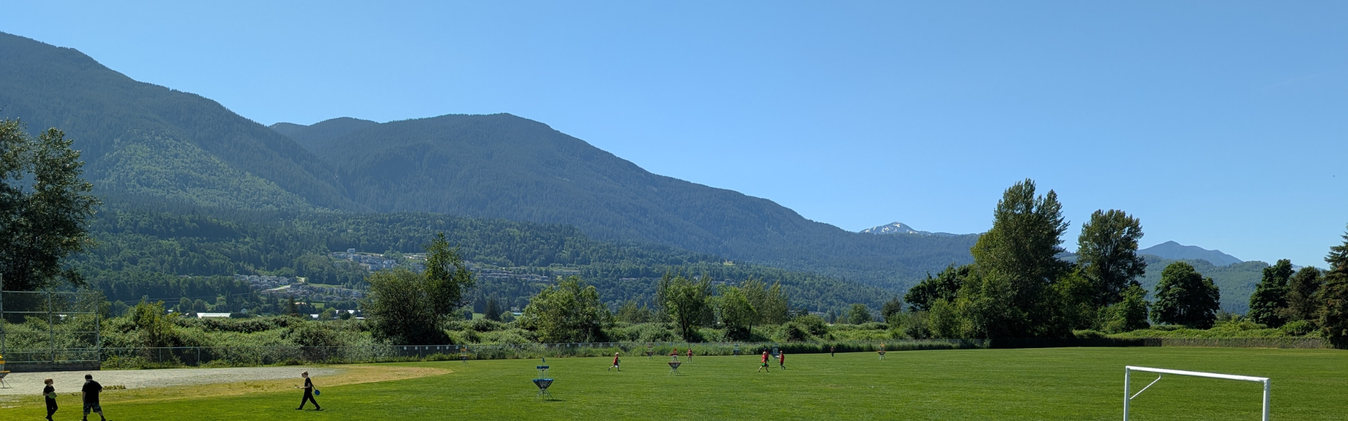 School field with mountains in background. 