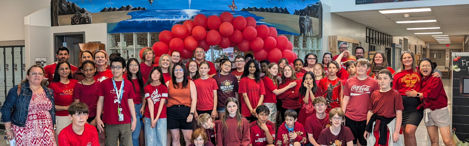 group of people wearing red shirts